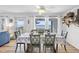 Spacious dining room boasts an ocean view, table for six, and coastal décor at 12458 1St W St, Treasure Island, FL 33706