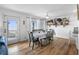 Bright dining room features a table for six, an ocean view, and access to the deck at 12458 1St W St, Treasure Island, FL 33706