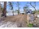 Spacious property with a beach house in the background and a stone sign marking the entrance at 12458 1St W St, Treasure Island, FL 33706