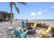 Outdoor firepit area with colorful chairs, perfect for gatherings with a view of the ocean at 12458 1St W St, Treasure Island, FL 33706