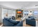 Welcoming living room with a stone fireplace, comfortable seating, and picturesque ocean views at 12458 1St W St, Treasure Island, FL 33706