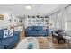 Inviting living room with built-in shelving and comfortable blue sofas at 12458 1St W St, Treasure Island, FL 33706