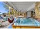 Beachside patio features a hot tub, stairs to the beach, and plenty of room for activities at 12458 1St W St, Treasure Island, FL 33706