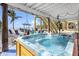 Beachside patio features a hot tub, stairs to the beach, and plenty of room for activities at 12458 1St W St, Treasure Island, FL 33706
