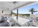 Beautiful porch with dining and rocking chairs overlooking the ocean at 12458 1St W St, Treasure Island, FL 33706