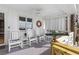 Inviting porch with rocking chairs, nautical decor, and a glimpse of the ocean view at 12458 1St W St, Treasure Island, FL 33706