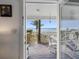 A picturesque view of the beach and ocean from the porch at 12458 1St W St, Treasure Island, FL 33706