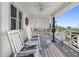 Relaxing porch with rocking chairs overlooking beach and ocean views at 12458 1St W St, Treasure Island, FL 33706