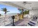 Charming porch offering scenic ocean views with comfortable seating and decor at 12458 1St W St, Treasure Island, FL 33706