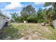 Spacious backyard with a storage shed, mature trees, and ample space for recreation at 12660 118Th St, Largo, FL 33778