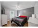 Bright bedroom with a ceiling fan, and wood-look floors, offering a serene retreat at 12660 118Th St, Largo, FL 33778