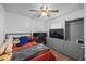 Cozy bedroom featuring a ceiling fan, computer setup, and contemporary furniture at 12660 118Th St, Largo, FL 33778