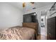 Comfortable bedroom with dark wood floors and a view into the bathroom at 12660 118Th St, Largo, FL 33778