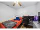 Cozy bedroom featuring a ceiling fan, computer setup, and contemporary furniture at 12660 118Th St, Largo, FL 33778