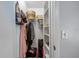Functional closet providing storage with built-in shelving and hanging space for organization at 12660 118Th St, Largo, FL 33778