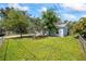 Landscaped front yard and mature trees enhance the curb appeal of this home at 12660 118Th St, Largo, FL 33778