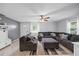 Spacious living room featuring tile flooring, a sectional sofa, and ample natural light at 12660 118Th St, Largo, FL 33778