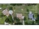 The aerial shot shows the property's layout, landscaping, nearby homes, and surrounding natural areas at 13122 Done Groven Dr, Dover, FL 33527