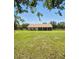 The backyard is spacious, and the covered patio and ample land create a great outdoor living space at 13122 Done Groven Dr, Dover, FL 33527