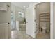 This well-lit bathroom features a tub, toilet and doorway to the backyard at 13122 Done Groven Dr, Dover, FL 33527