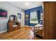 Charming bedroom with hardwood floors, natural light, stylish decor, and comfortable furnishings at 13122 Done Groven Dr, Dover, FL 33527
