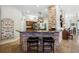 Spacious kitchen features a breakfast bar with brick accents and modern appliances, creating a warm, inviting space at 13122 Done Groven Dr, Dover, FL 33527