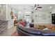 Spacious living room features hardwood floors, comfortable seating, and bright lighting at 13122 Done Groven Dr, Dover, FL 33527