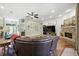 Bright and spacious living room featuring a brick fireplace and comfortable seating at 13122 Done Groven Dr, Dover, FL 33527