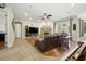 Comfortable living room with ample seating, brick fireplace, and hardwood floors at 13122 Done Groven Dr, Dover, FL 33527