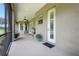 Spacious screened patio perfect for outdoor entertaining, featuring a ceiling fan and lush views at 13122 Done Groven Dr, Dover, FL 33527