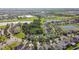 An aerial view of a suburban neighborhood with ponds, and tree lined streets at 1314 Oak Pond St, Ruskin, FL 33570