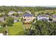 Aerial backyard view with lush green lawn, fenced yard, and a patio area at 1314 Oak Pond St, Ruskin, FL 33570