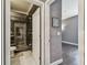 Bathroom with glass shower door, marble flooring, and tiled walls at 1314 Oak Pond St, Ruskin, FL 33570