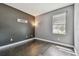 Well-lit bedroom with hardwood floors, fresh paint, and a large window at 1314 Oak Pond St, Ruskin, FL 33570