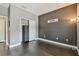 Cozy bedroom features wood floors, closet, and neutral paint at 1314 Oak Pond St, Ruskin, FL 33570