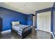 Blue bedroom featuring a twin bed, a window with a view, and a closet at 1314 Oak Pond St, Ruskin, FL 33570