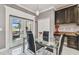 Cozy dining area with a modern glass table, stylish chairs, and patio access at 1314 Oak Pond St, Ruskin, FL 33570