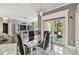 Bright dining area with modern glass table, black chairs and outdoor view at 1314 Oak Pond St, Ruskin, FL 33570