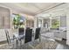 Dining room with modern chandelier, seating for six, and lots of natural light at 1314 Oak Pond St, Ruskin, FL 33570