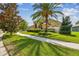 Well-maintained home with a beautiful lawn, mature landscaping, and a charming pathway at 1314 Oak Pond St, Ruskin, FL 33570