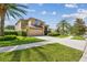 Well-kept lawn and landscaping leading up to a two-story home at 1314 Oak Pond St, Ruskin, FL 33570