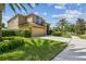 Lovely front yard featuring a well-manicured lawn and mature palm trees at 1314 Oak Pond St, Ruskin, FL 33570