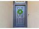 Elegant front door featuring a wreath, modern hardware, and a welcoming entrance at 1314 Oak Pond St, Ruskin, FL 33570