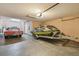 Spacious garage featuring both a vintage car and two jet skis on a trailer at 1314 Oak Pond St, Ruskin, FL 33570