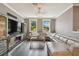 Elegant living room with a large TV, comfortable seating, and natural light at 1314 Oak Pond St, Ruskin, FL 33570