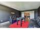 Inviting living room featuring comfortable seating, a foosball table, and easy access to adjacent spaces at 1314 Oak Pond St, Ruskin, FL 33570