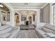 Open living space with decorative archways and columns and a dining area at 1314 Oak Pond St, Ruskin, FL 33570