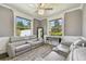 Cozy living room offers comfortable seating, large windows with bright natural light, and modern accents at 1314 Oak Pond St, Ruskin, FL 33570