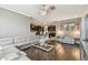 Open-concept living room featuring dark hardwood floors, stylish furniture, and plenty of natural light at 1314 Oak Pond St, Ruskin, FL 33570