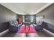 Entertainment room with comfortable seating, vibrant rug, and a built-in foosball table for Gathering fun at 1314 Oak Pond St, Ruskin, FL 33570